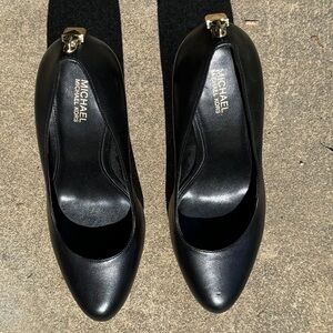 Michael Kors black leather heels with gold accent on heels.